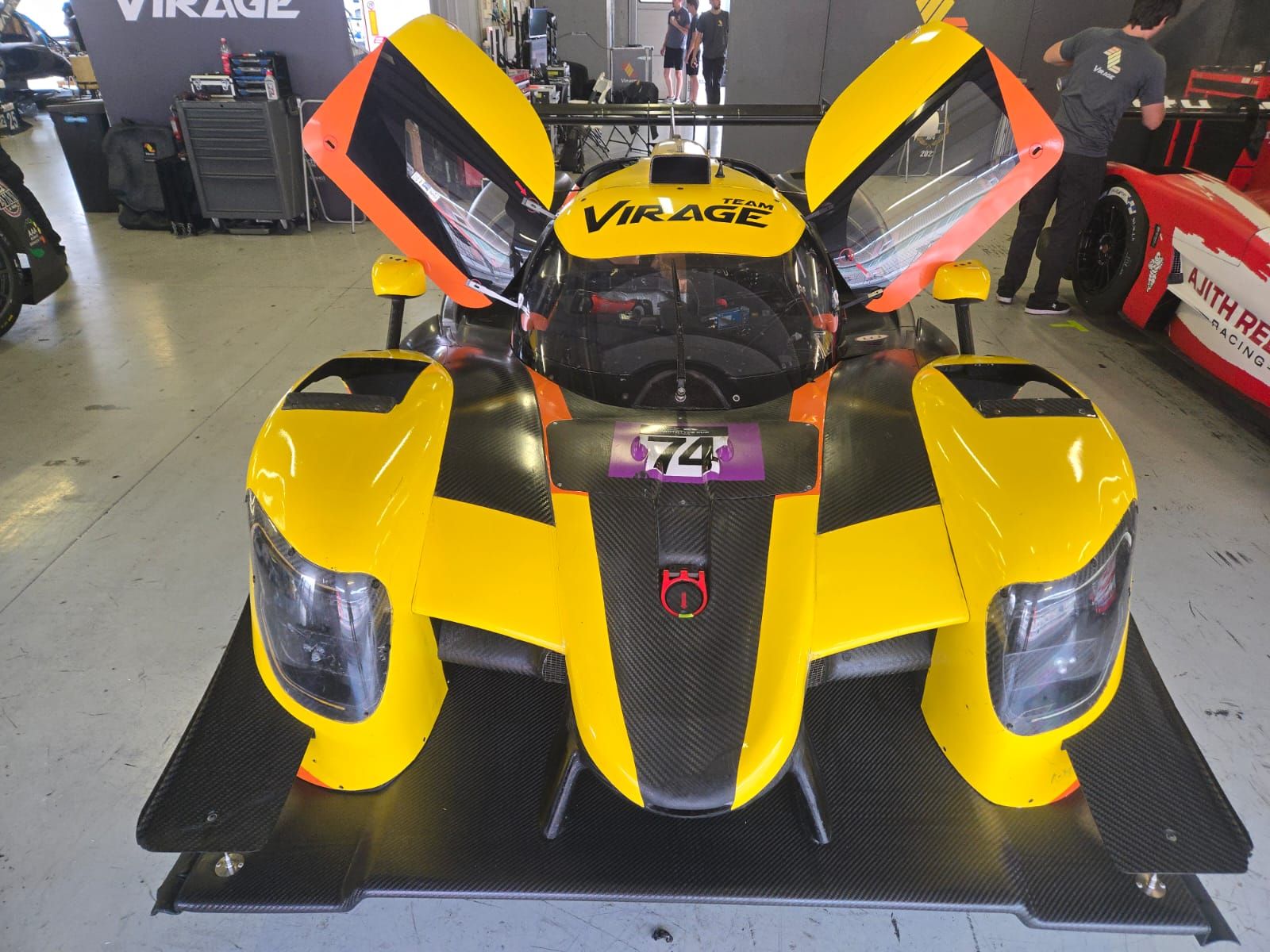 The #74 Team Virage Ligier in the garage with both doors open