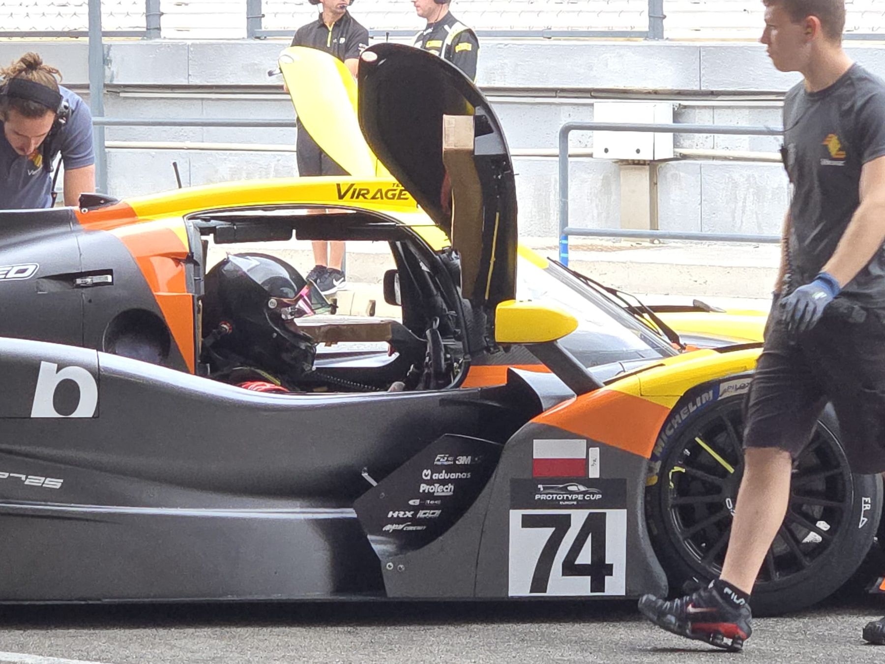 Jacob in the cockpit of the #74 Team Virage Ligier in pit lane, doors open